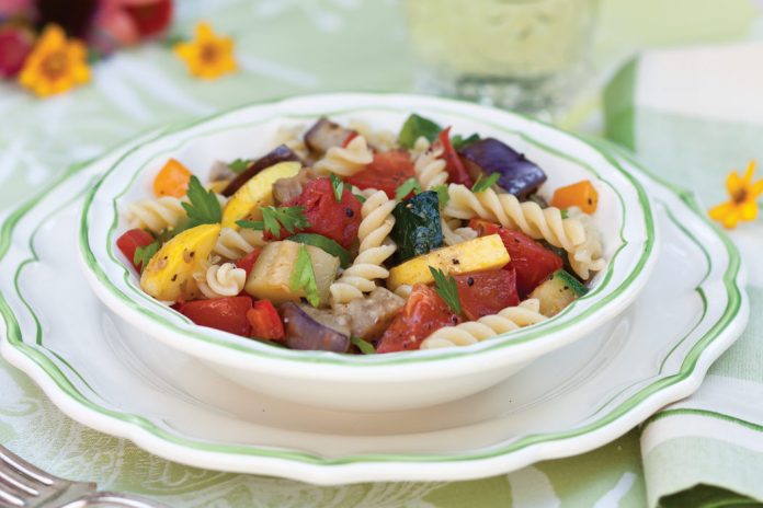 A dish that celebrates the garden, Summer- Vegetable Ratatouille is a jumble of eggplant, squash, zucchini, bell peppers, onions, & tomatoes.
