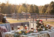 rranged outside the stables, a romantic table is laden with colorful flowers, lush greenery, and Julie Wear china.