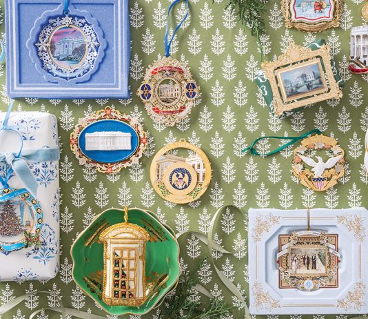 Historic Holiday Decor: White House ornaments viewed from above, atop a green-and-white paper surface, a collection of White House ornaments is carefully displayed.