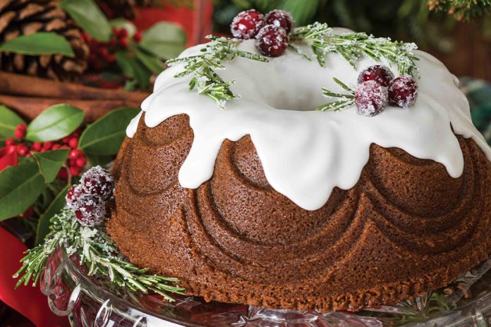 Our Gingerbread Bundt Cake is dressed with sugared rosemary and cranberries, set to look like holly.