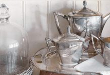 A silver tea set adds simple elegance with its sleek design.
