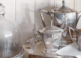 A silver tea set adds simple elegance with its sleek design.