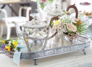 Teatime Bliss 2023 Preview Featured Silver Tea Service Alt Text: Set atop a silver tray, a silver tea set awaits the occasion.