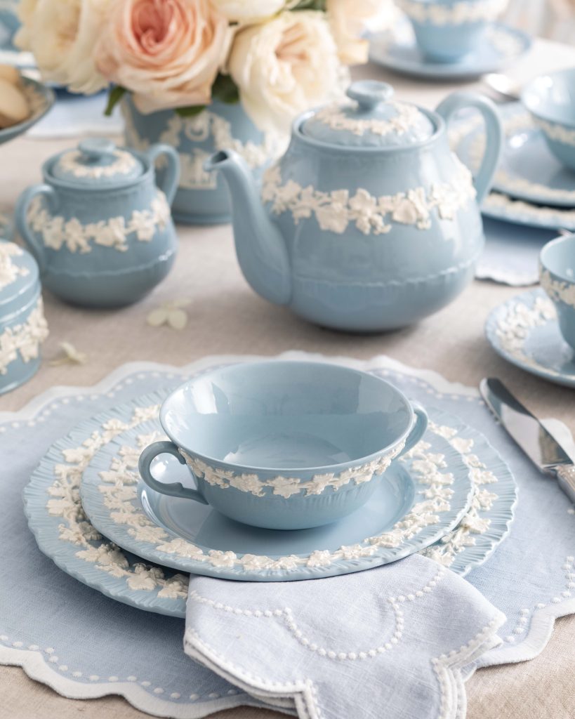 A teapot, bowl, and plates in Wedgwood’s blue-and-white Queen’s Ware pattern await the service of warm winter soup.