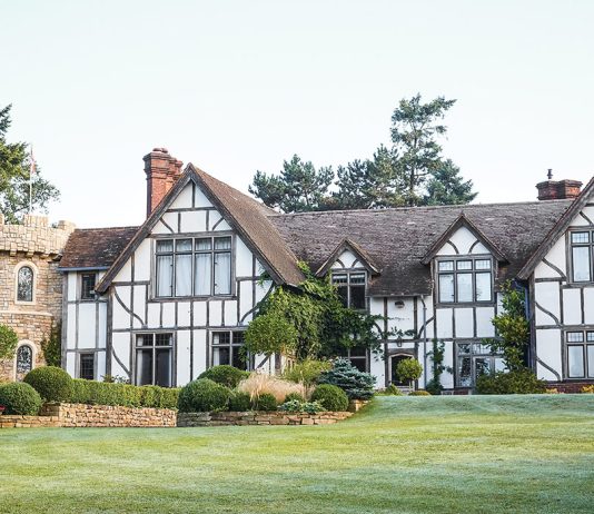 This half-timber-style home bears some architectural resemblance to a castle in addition to an English cottage.