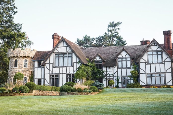 This half-timber-style home bears some architectural resemblance to a castle in addition to an English cottage.